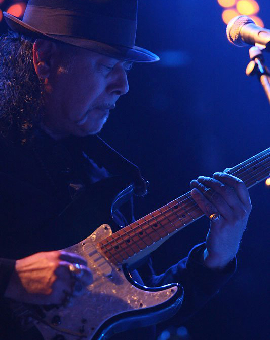 Blues performer on guitar